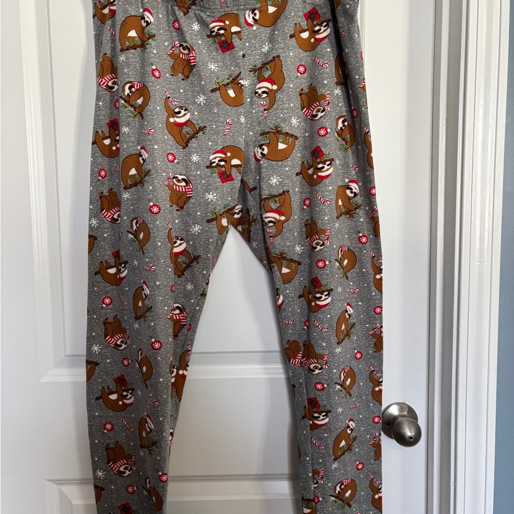2 pair of leggings. Gray Sloth Print Lounge Pants and Santa Print Lounge Pants